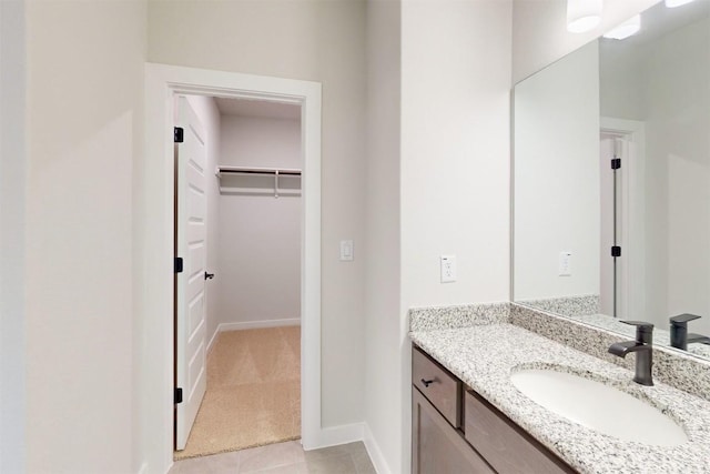 bathroom with tile patterned flooring and vanity