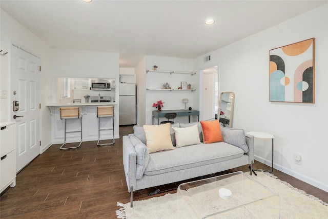 living room with dark hardwood / wood-style flooring