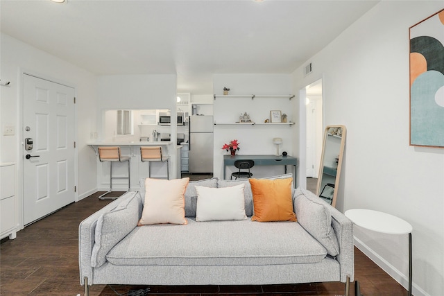 living room with dark hardwood / wood-style floors