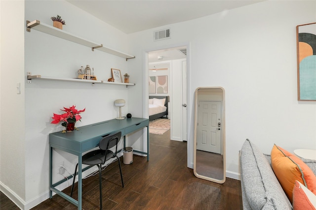 home office with dark wood-type flooring