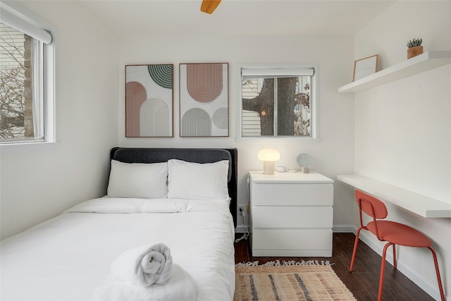 bedroom featuring ceiling fan and dark hardwood / wood-style flooring