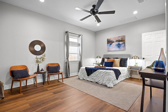 bedroom featuring ceiling fan and hardwood / wood-style floors