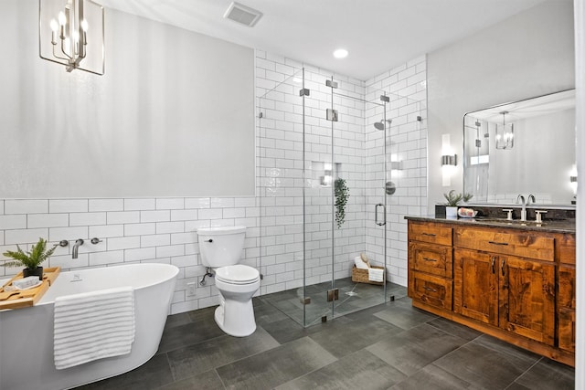 full bathroom with toilet, shower with separate bathtub, tile walls, tile patterned floors, and vanity