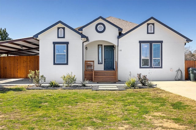 view of front of house featuring a front yard and a carport