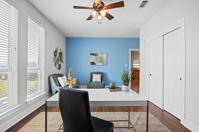 office featuring ceiling fan and dark wood-type flooring