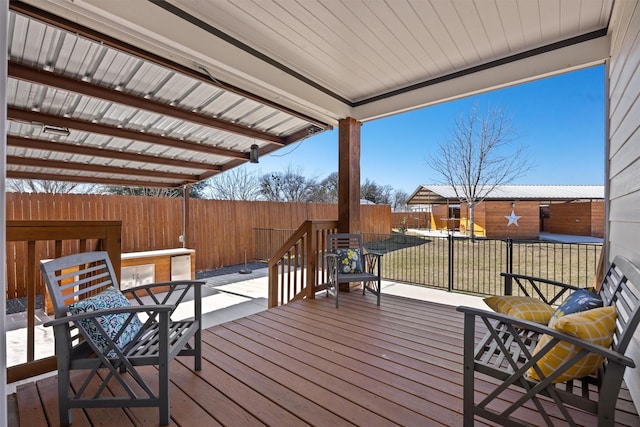 wooden terrace with a lawn