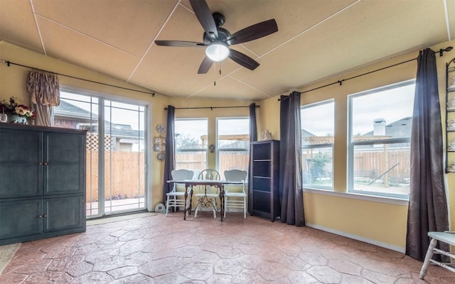 unfurnished sunroom featuring lofted ceiling and ceiling fan