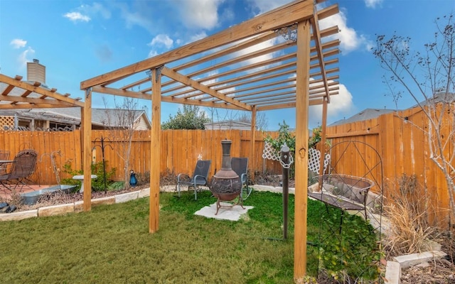 view of yard with an outdoor fire pit and a pergola