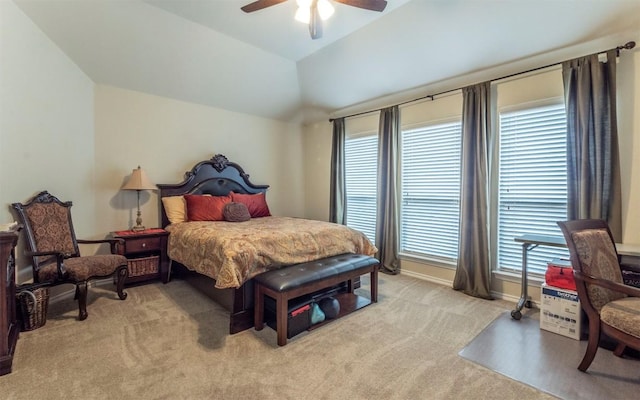 bedroom with vaulted ceiling, light carpet, and ceiling fan