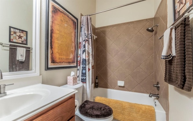 full bathroom with vanity, shower / bath combination with curtain, and toilet