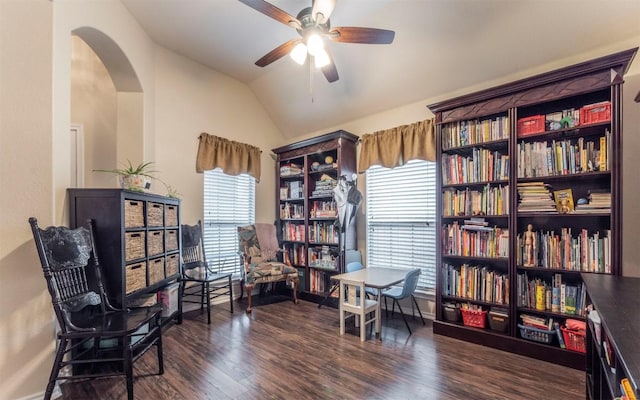 sitting room with lofted ceiling, ceiling fan, arched walkways, and wood finished floors