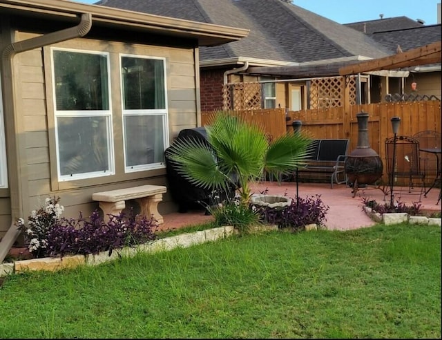 view of yard featuring a patio area and fence