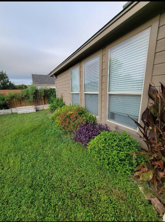 view of property exterior with a yard