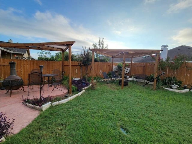 view of yard with a patio, fence, and a pergola