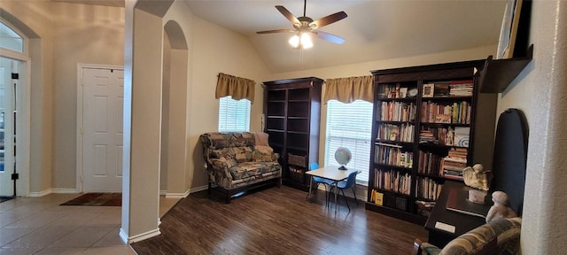 11513 Glen Knoll Dr, Manor, TX 78653 - sitting room featuring arched walkways, lofted ceiling, a ceiling fan, baseboards, and wood finished floors