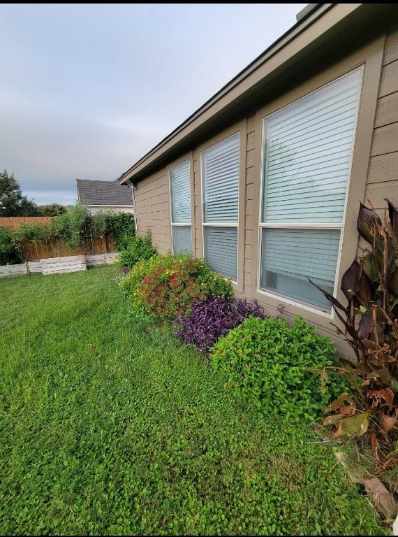 11513 Glen Knoll Dr, Manor, TX 78653 - view of home's exterior featuring a lawn