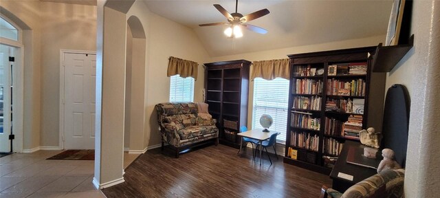 11513 Glen Knoll Dr, Manor, TX 78653 - living area featuring arched walkways, lofted ceiling, ceiling fan, and wood finished floors