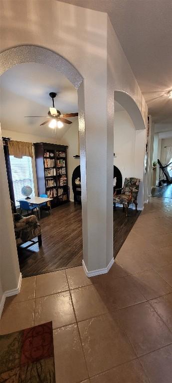 11513 Glen Knoll Dr, Manor, TX 78653 - corridor featuring arched walkways and tile patterned floors