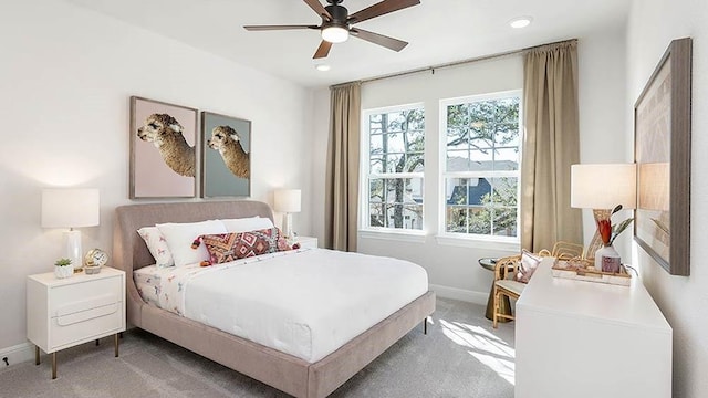 bedroom featuring ceiling fan and carpet flooring