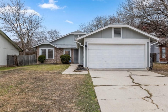 ranch-style house with a garage and a front yard