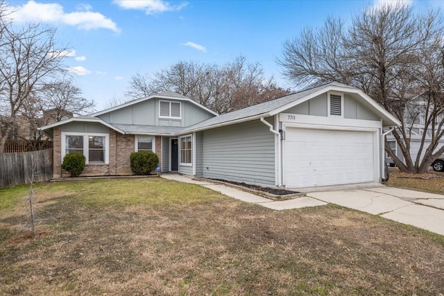 view of front of home with a garage and a front lawn