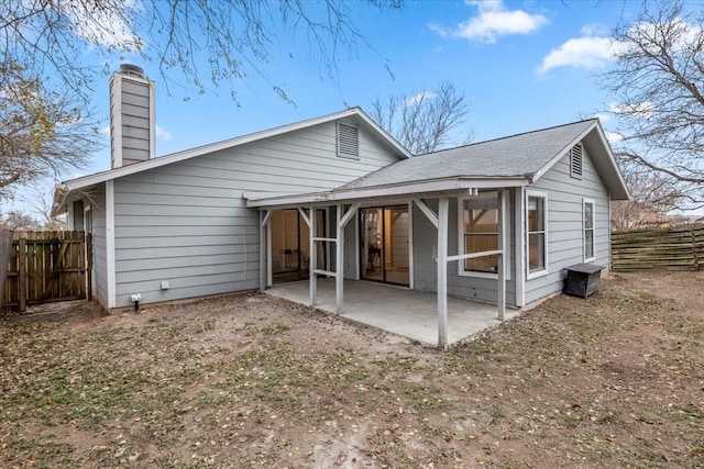 back of property featuring a patio area