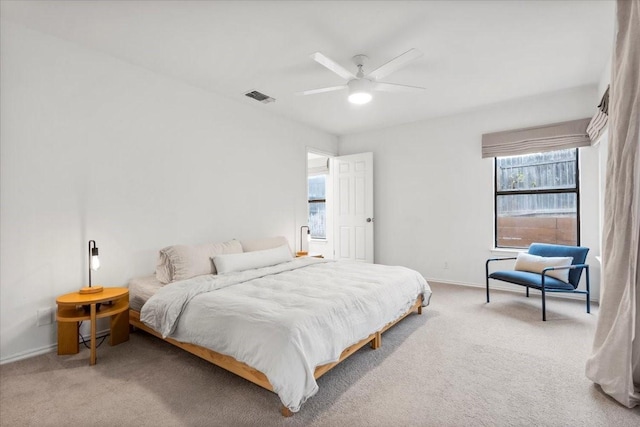 bedroom with ceiling fan and carpet flooring