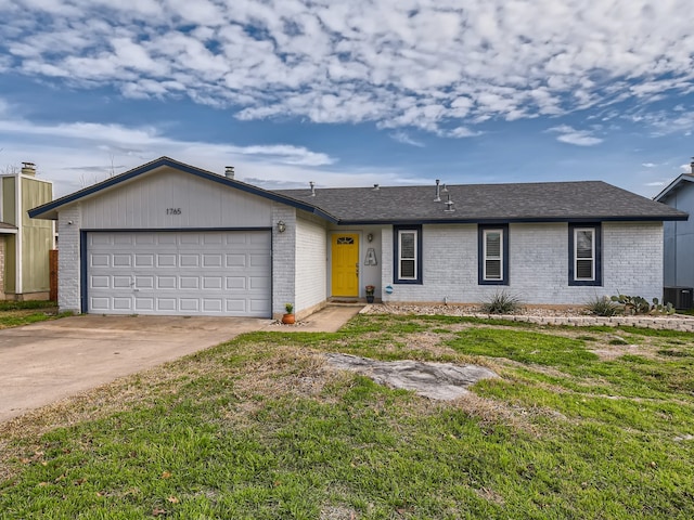 single story home featuring a front yard, central AC unit, and a garage