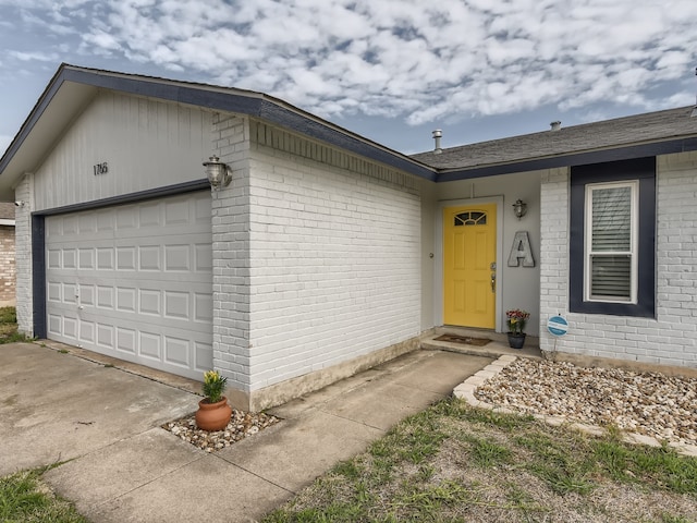 doorway to property featuring a garage