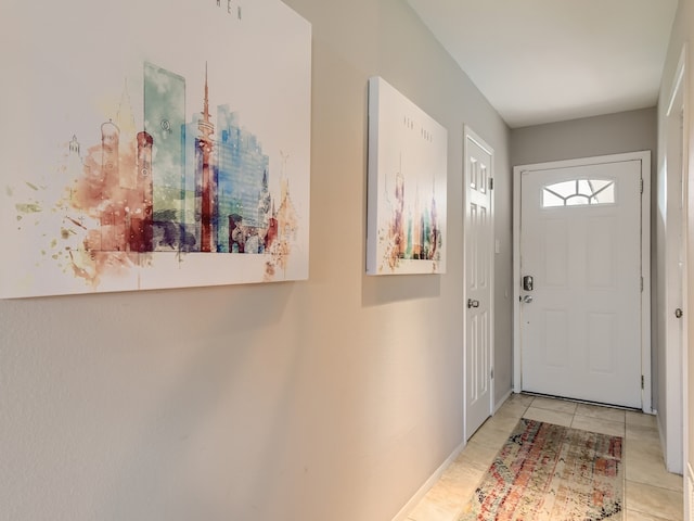 doorway with light tile patterned floors