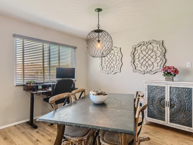 dining space with light hardwood / wood-style floors