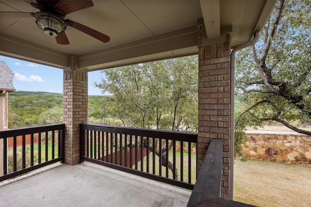 exterior space with ceiling fan