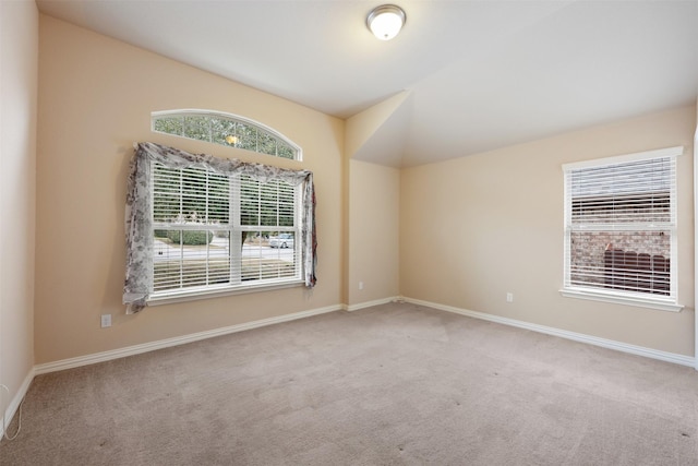 carpeted empty room with a wealth of natural light