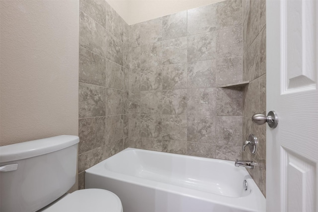 bathroom featuring toilet and  shower combination