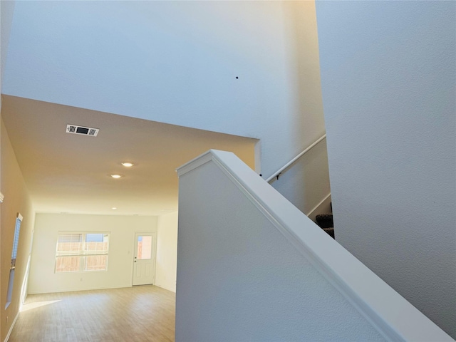 stairs with wood-type flooring