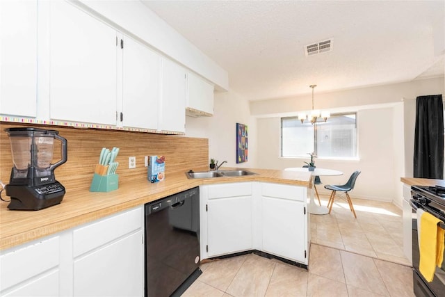 kitchen featuring light countertops, black dishwasher, light tile patterned floors, and a sink