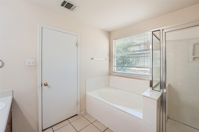 bathroom with vanity, independent shower and bath, and tile patterned flooring