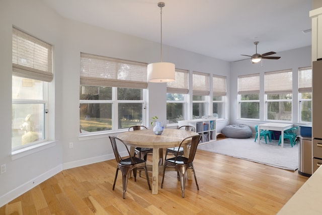 sunroom with ceiling fan and a wealth of natural light