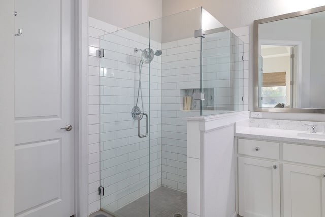 bathroom featuring vanity and walk in shower