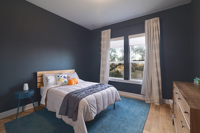 bedroom featuring light wood-type flooring