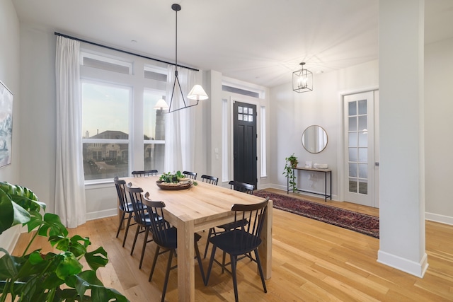 dining room featuring a chandelier and light wood-type flooring