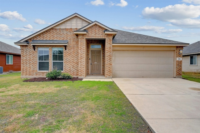 view of front of house with central air condition unit, a garage, and a front lawn