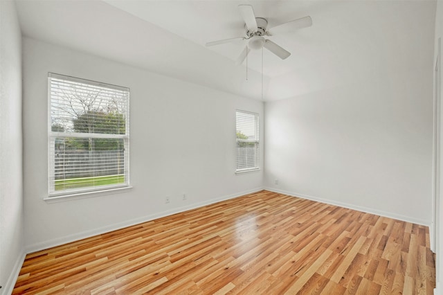 spare room featuring ceiling fan and light hardwood / wood-style flooring