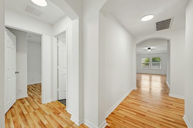 hallway with light wood-type flooring