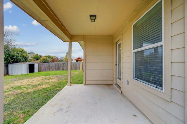 view of patio / terrace with a storage shed