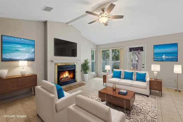 living room with ceiling fan, light tile patterned floors, and lofted ceiling with beams