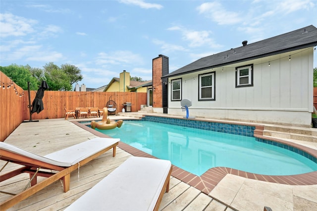 view of pool featuring a wooden deck