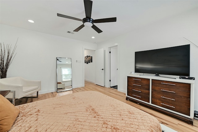 bedroom with light wood-type flooring and ceiling fan