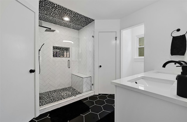 bathroom featuring tile patterned flooring, walk in shower, and vanity