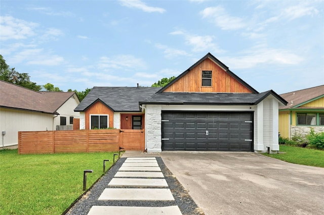 view of front of property with a garage and a front lawn